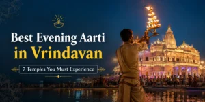 Priest performing evening Aarti at a famous temple in Vrindavan during sunset with devotees gathered for darshan